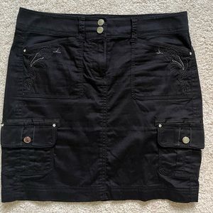 Black cargo skirt with silver stitching on pockets